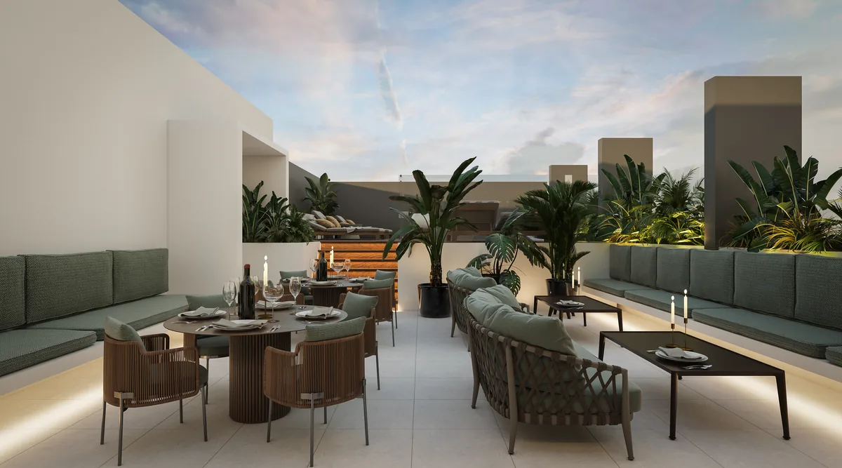 Rooftop de Oxygen al atardecer, con lounge, asadores y vegetación